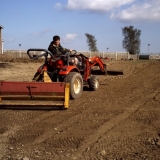 Joel on tractor Stone Rake