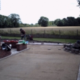 Sand layer is now compacted and screened, ready to start laying blocks. It also shows the extent of original slope on the right.