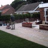 Compacting blocks and sand.